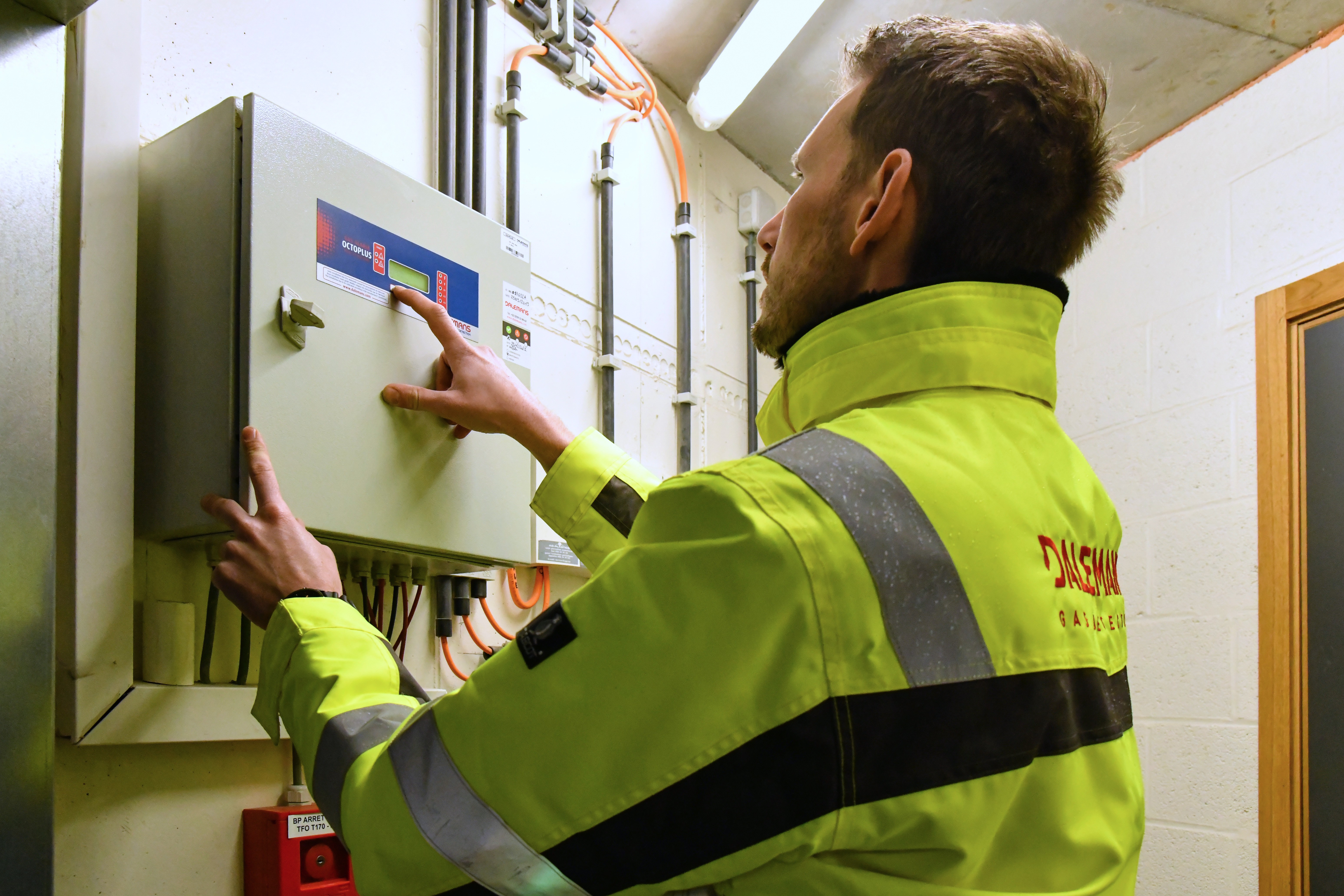 Dalemans technician consulting a gas management station on site